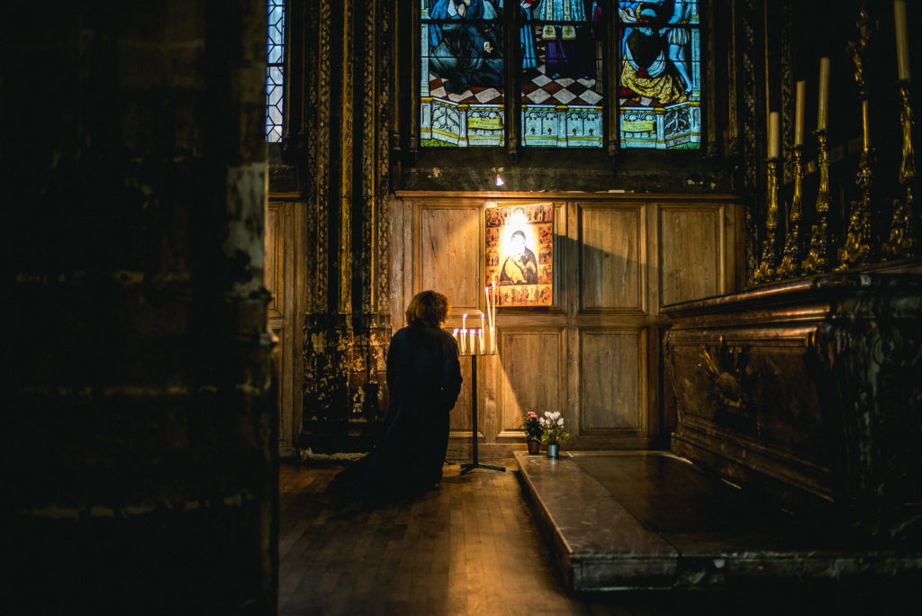 church priest kneeling prayer merson law New York IRCP