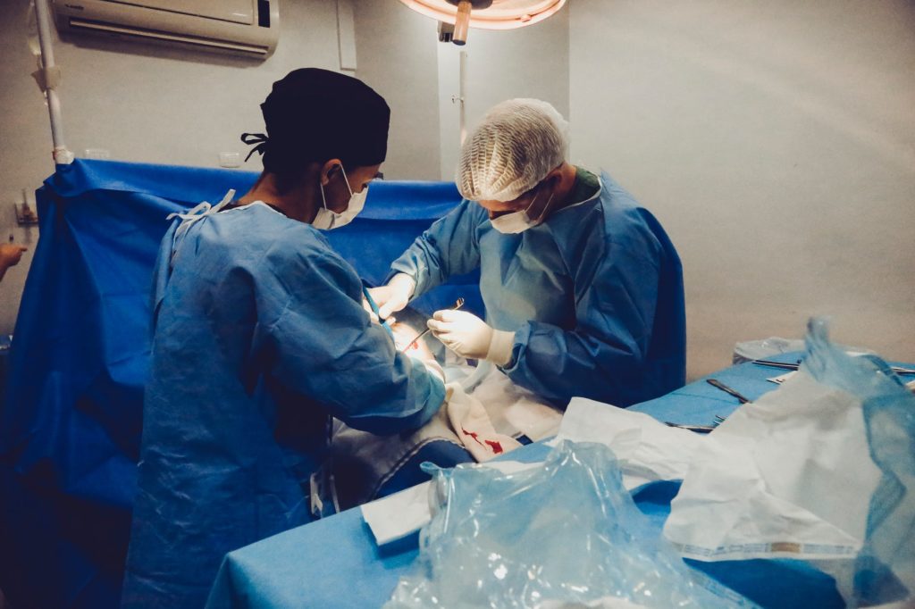 two surgeons operating on a patient - anesthesia error statistics nyc Merson Law PLLC