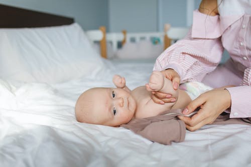 nurse checking baby's symptoms