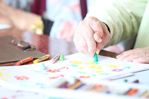 nursing home resident coloring with crayons