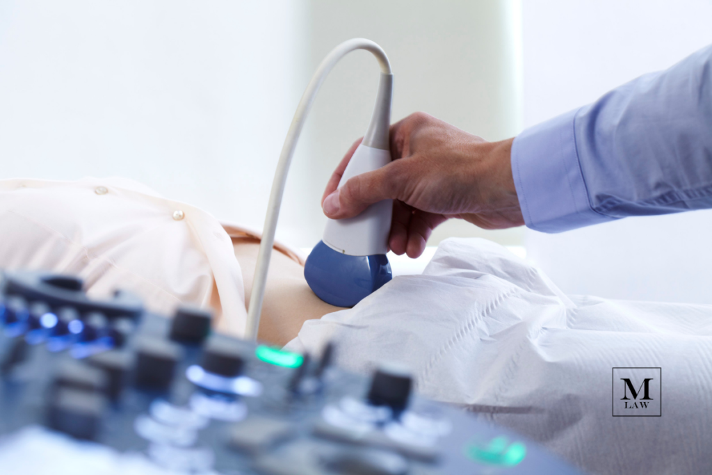 mother with ectopic pregnancy receiving ultrasound