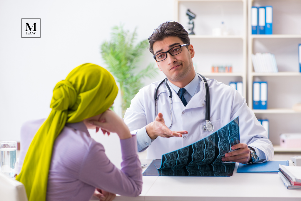 doctor shrugging at patient while showing patient their radiology reports