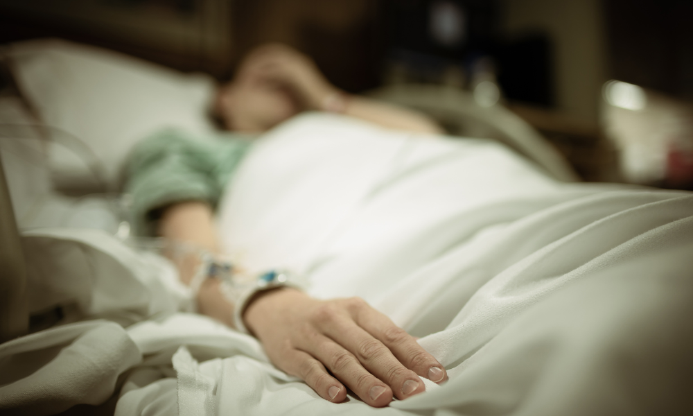 victim of Ricardo Cruciani in hospital bed, Midwife Malpractice