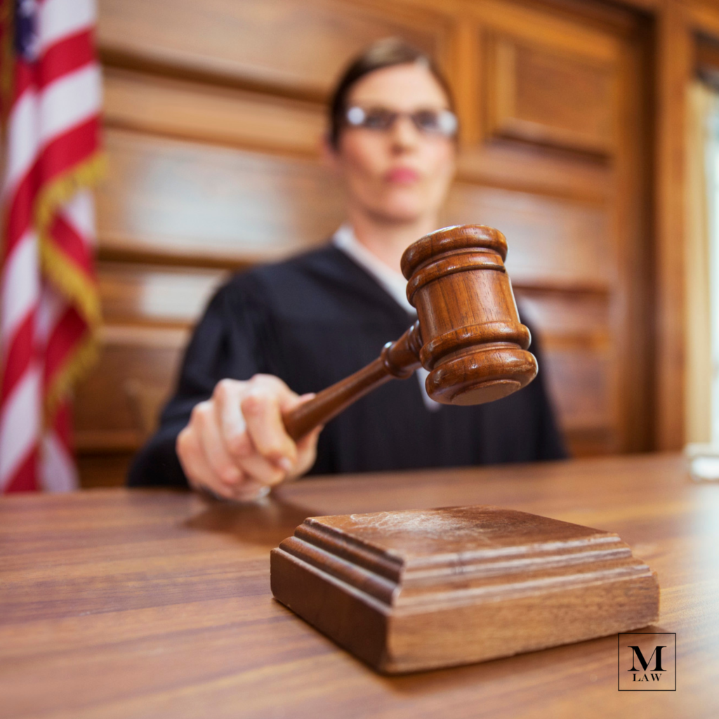 judge banging gavel during medical malpractice trial
